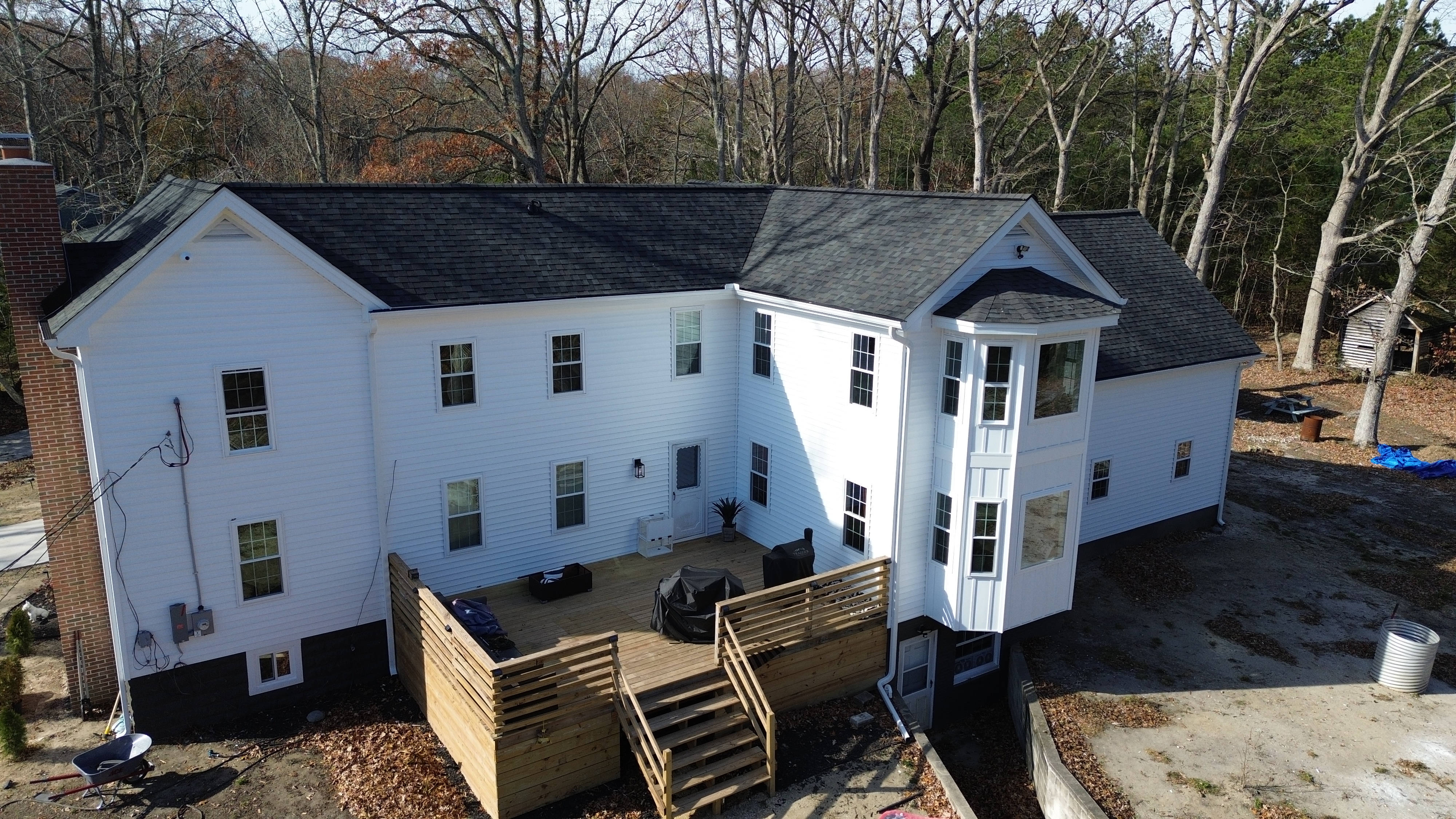 Siding contractor installing vinyl siding on a South Jersey home
