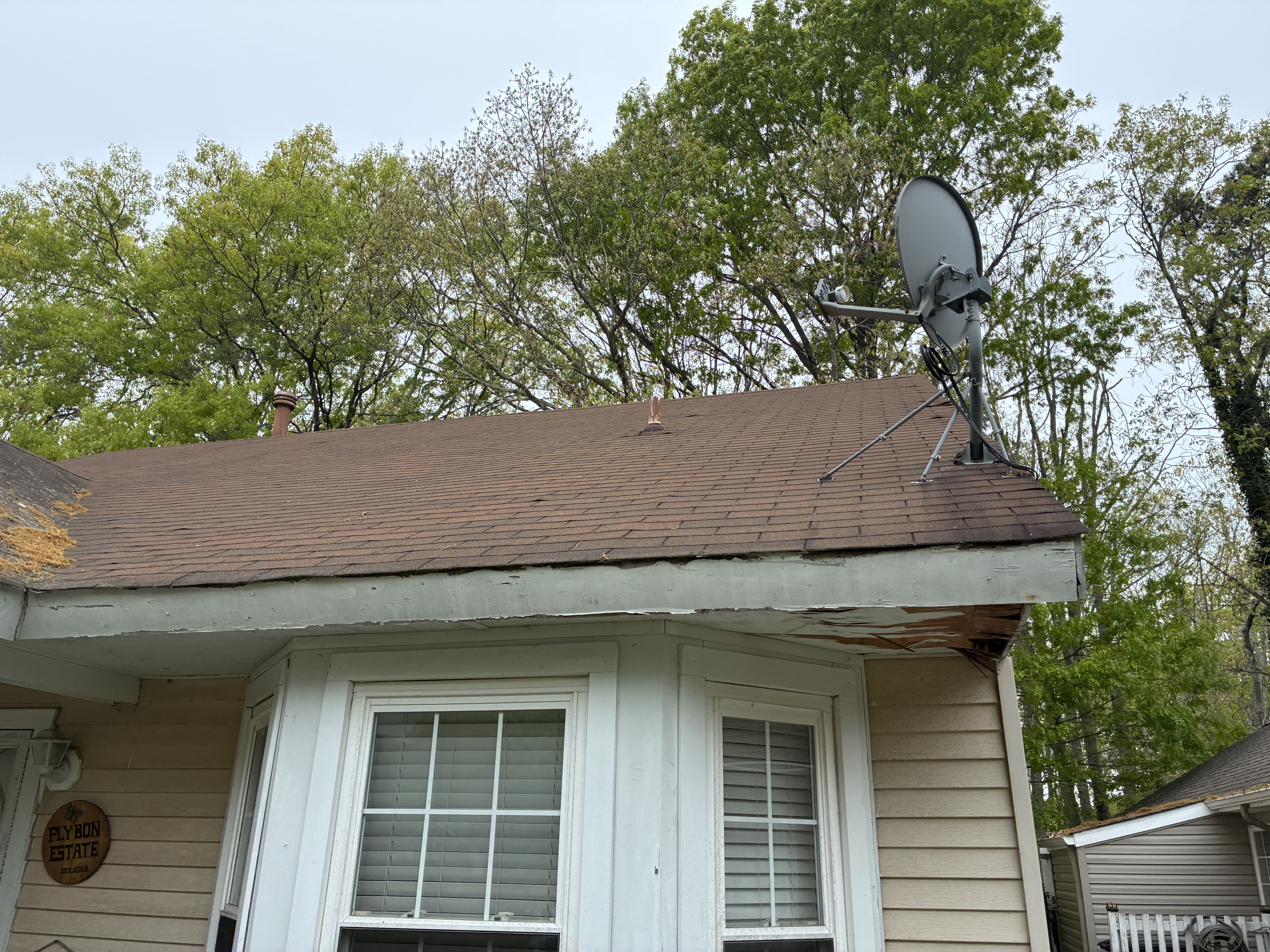 Twin Shield Roofing inspector reviewing findings with homeowner