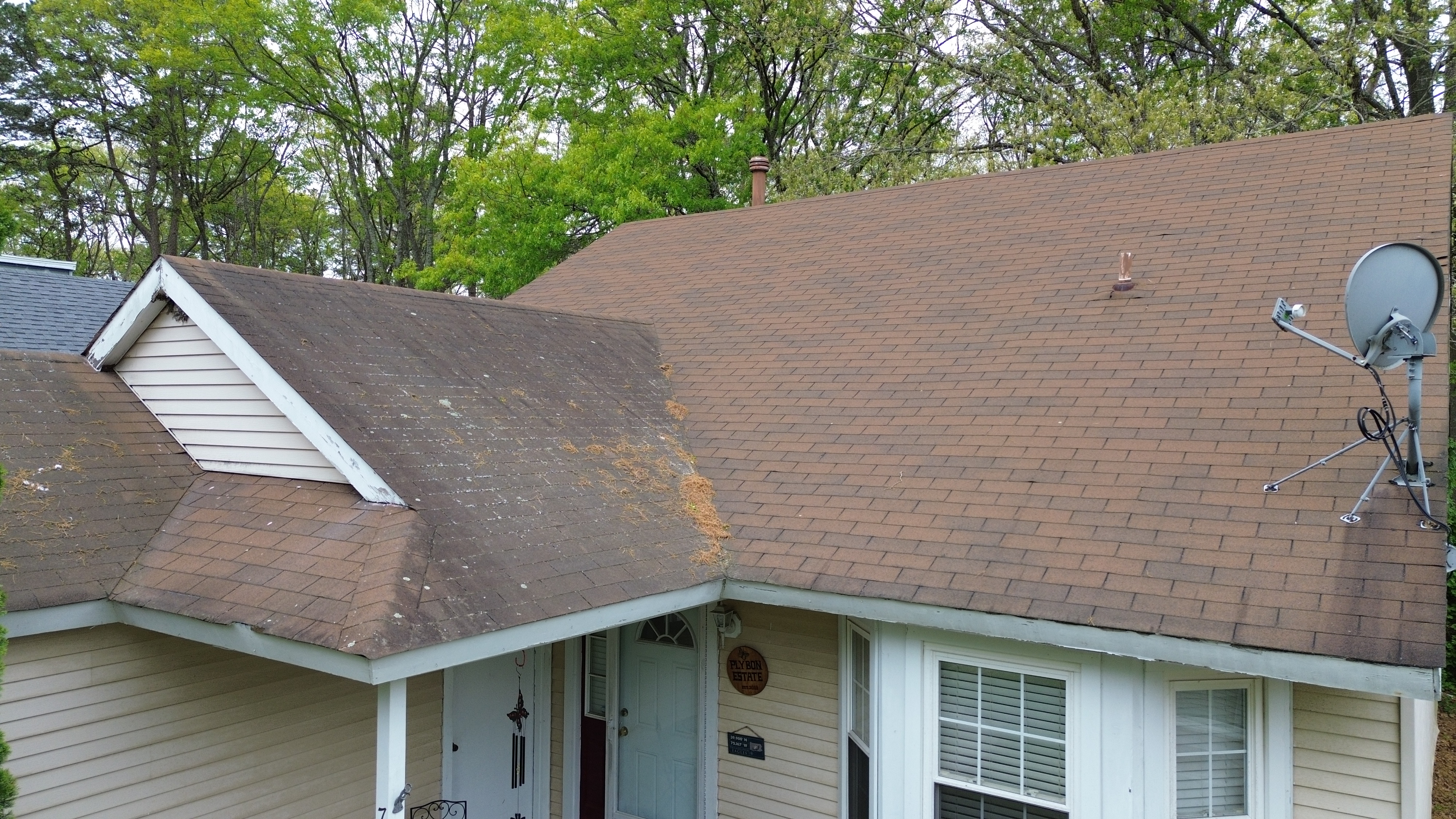 Roofing inspector holding written inspection report