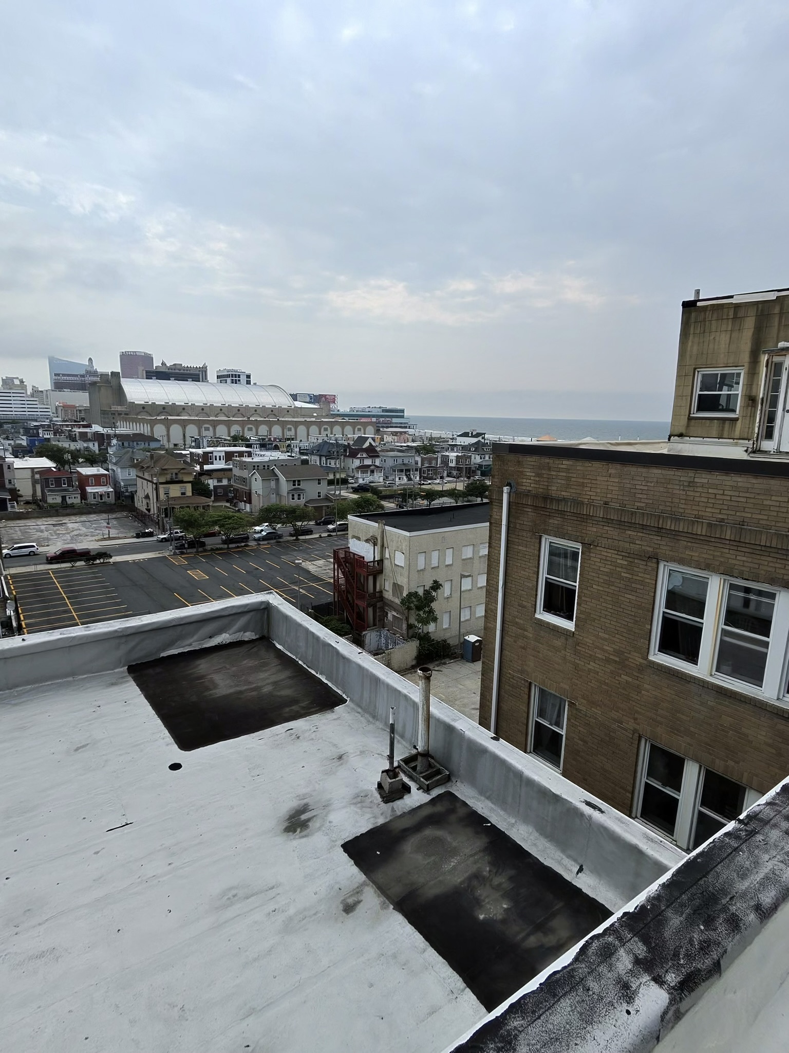 Twin Shield Roofing commercial crew on rooftop overlooking South Jersey