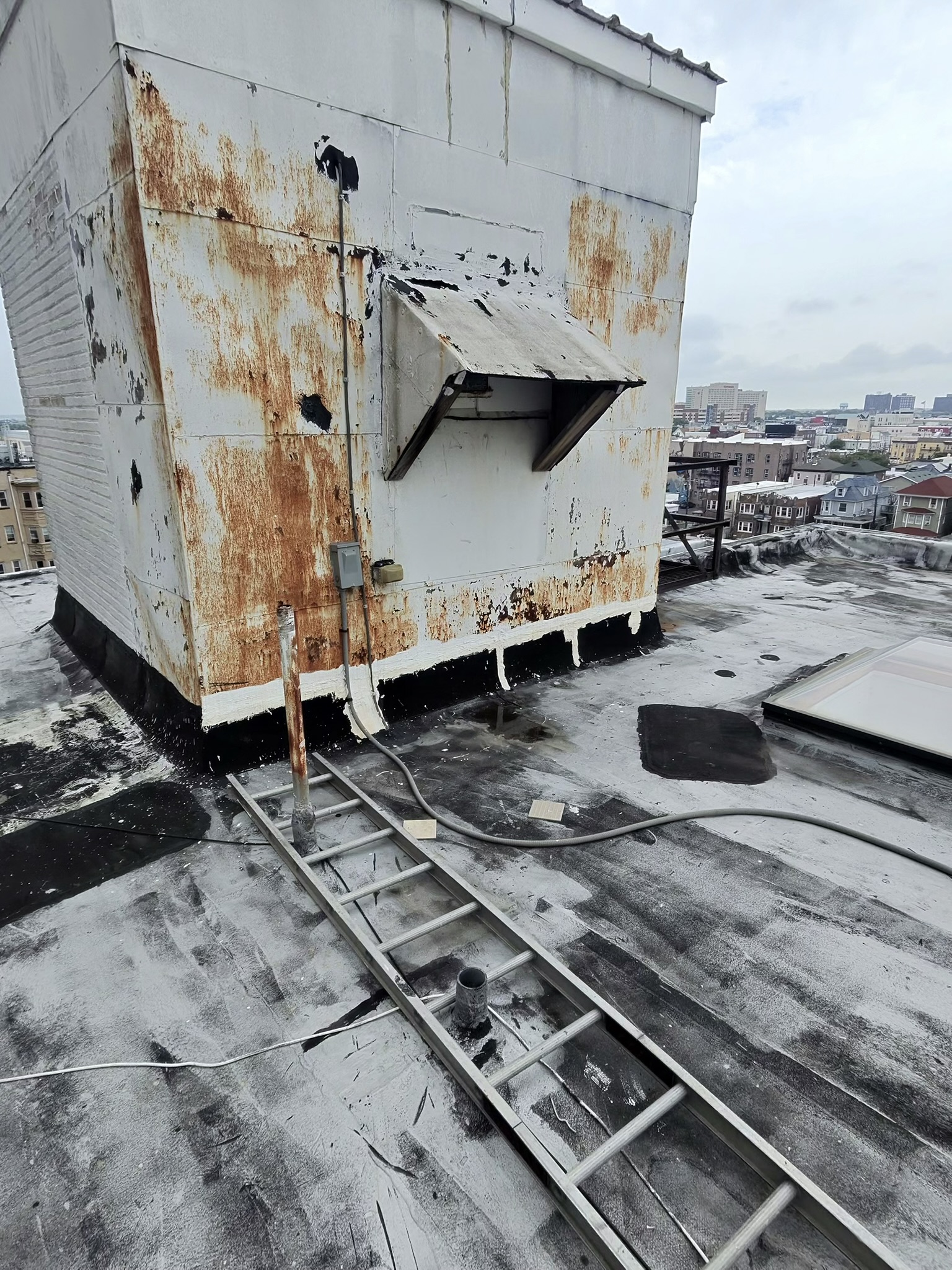 Roofing professional reviewing seasonal preparation checklist