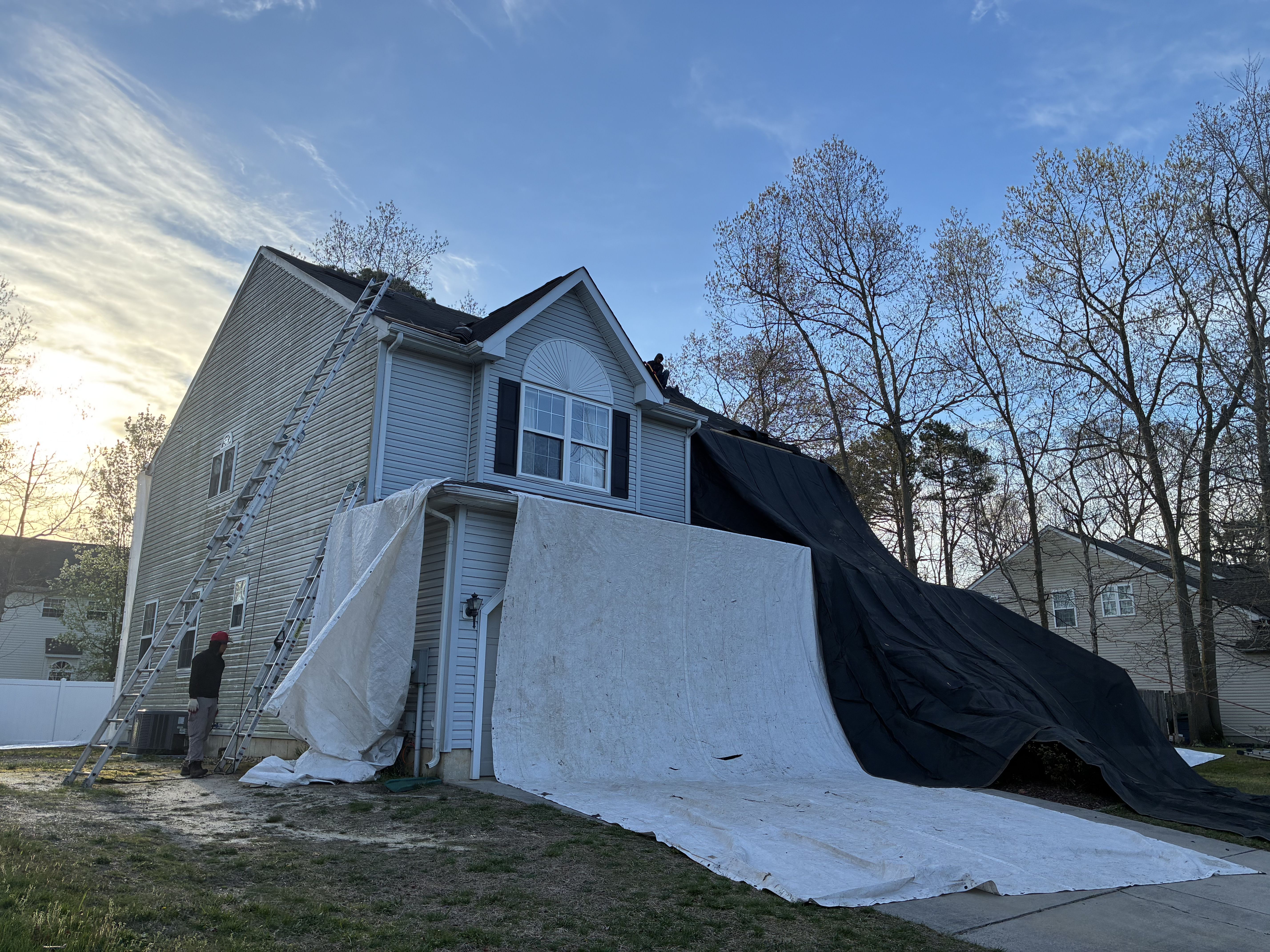 Dark architectural shingle roof with dormer window on New Jersey home