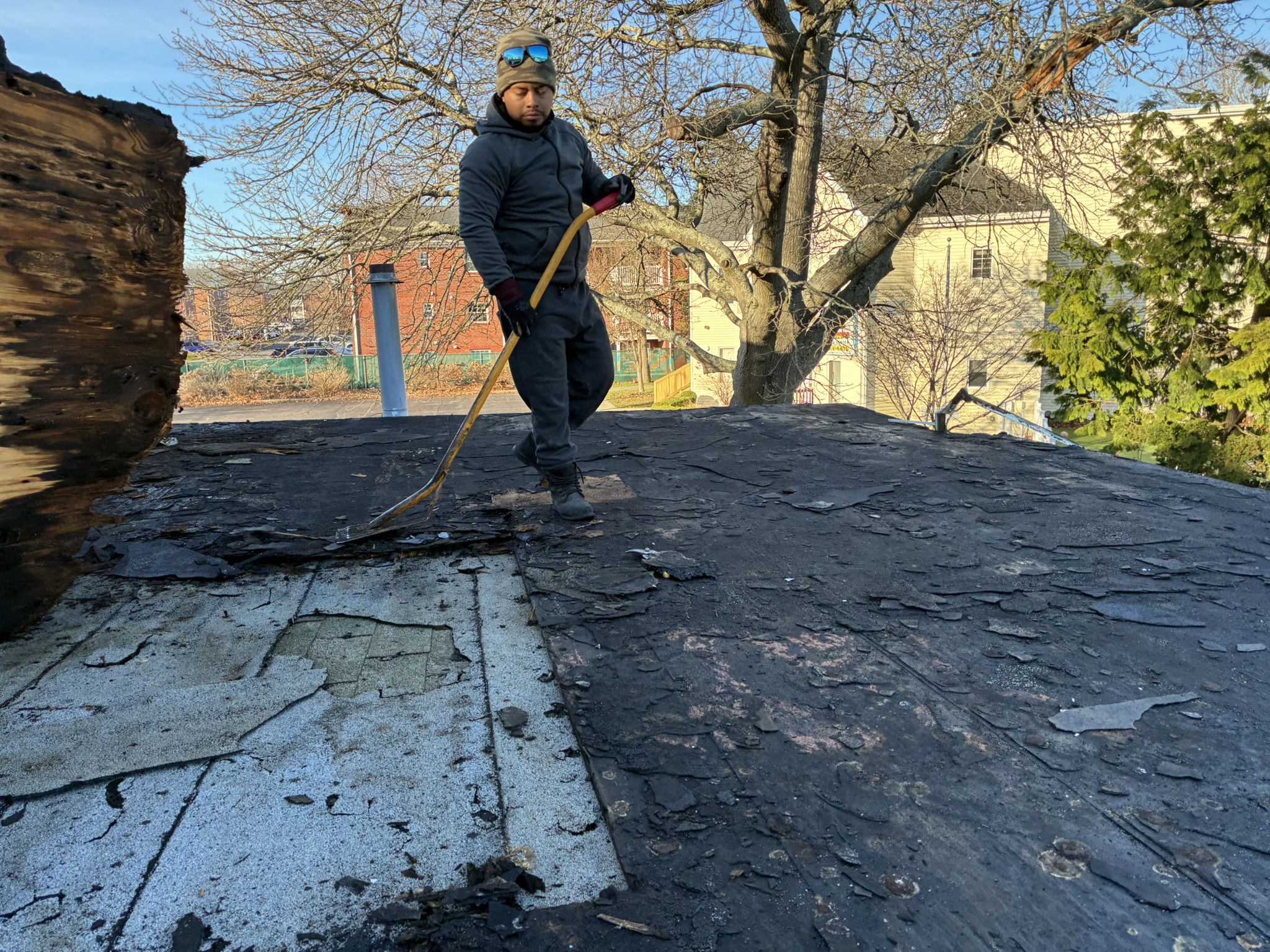 Twin Shield Roofing technician repairing shingles on a South Jersey residential roof