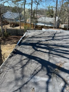 Roofer nailing shingles during a residential roof repair in South Jersey